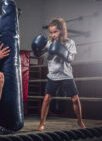 experienced boxer trainer is training new little girl boxer special competitions using punching bag 150x150 1 Kriica Online Web Designer Freelance